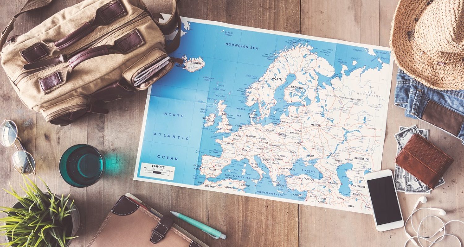 Travel concept on wooden background